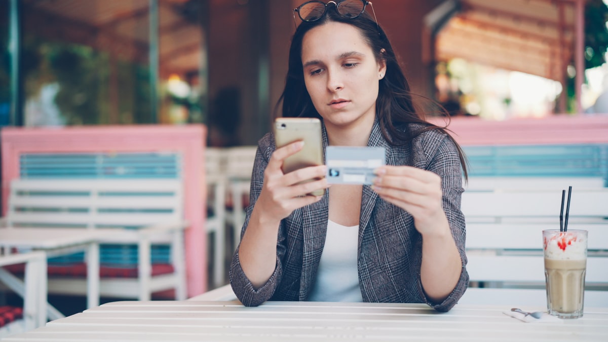 Smartphone showing digital loyalty card in Apple Wallet
